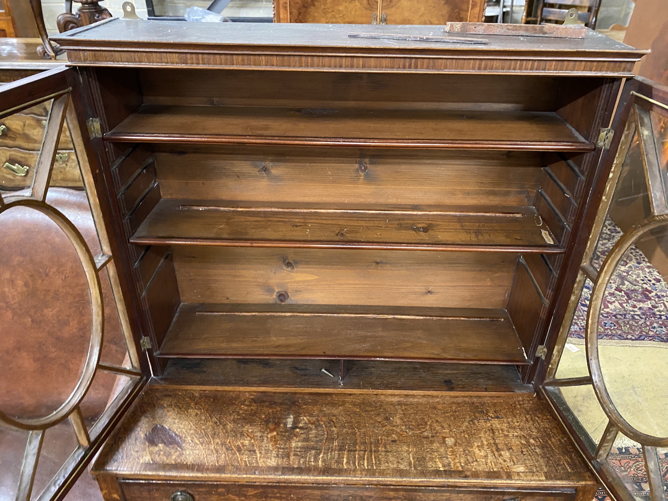 A George III glazed mahogany wall cabinet, width 75cm, depth 19cm, height 63cm